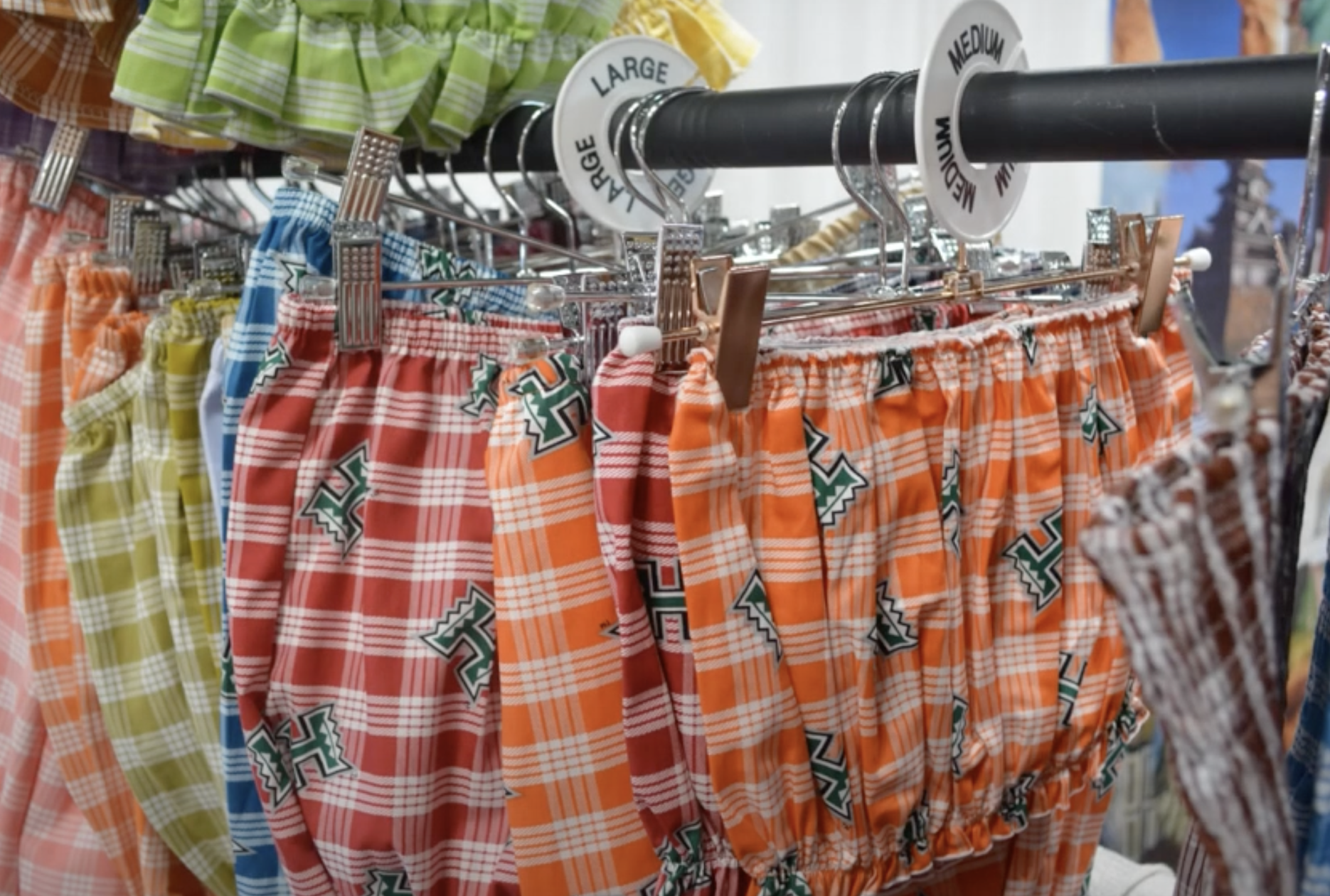Palaka printed shorts adorned with the University of Hawaiʻi logo